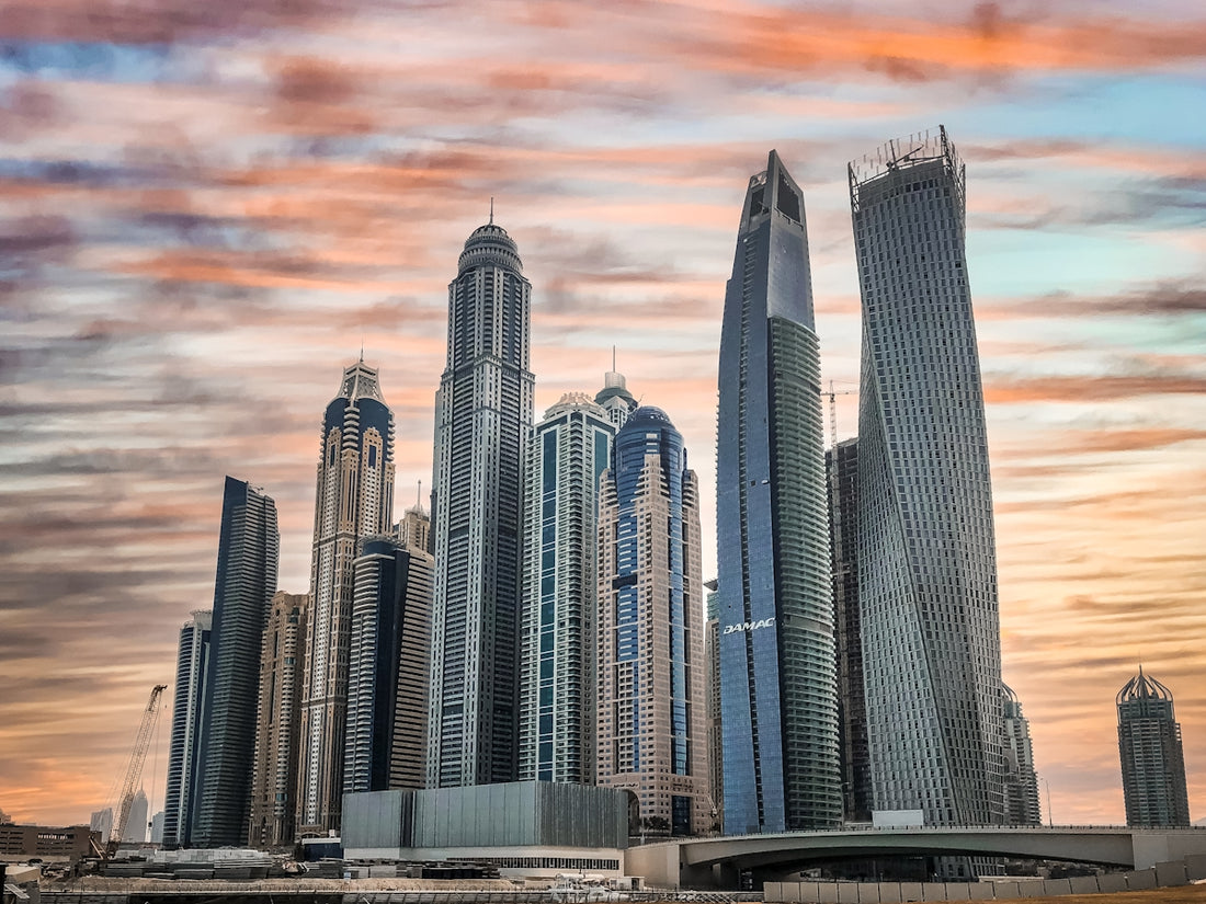 gray high rise buildings under cloudy sky during daytime