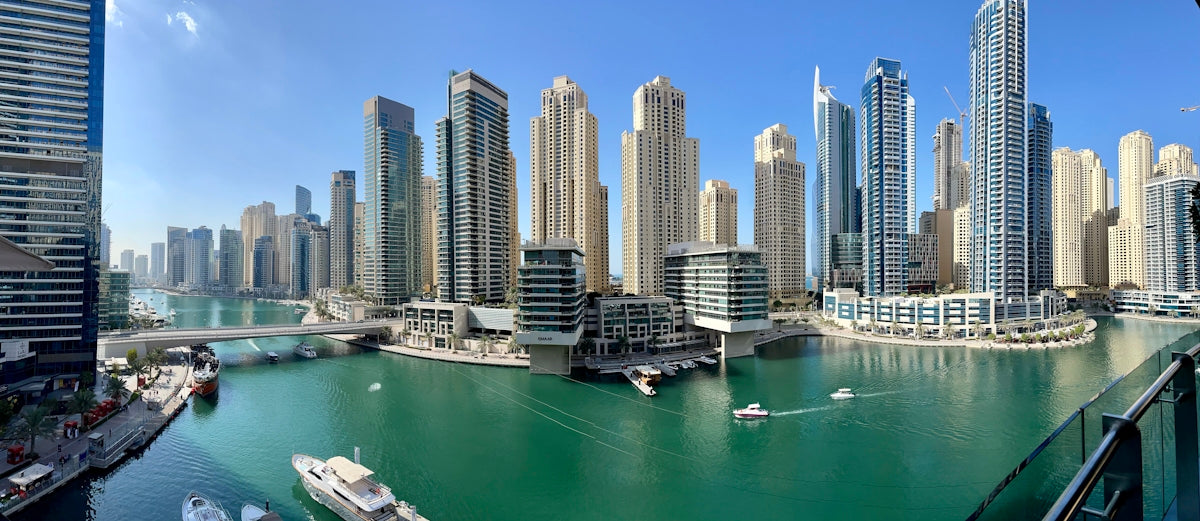 high rise buildings near body of water during daytime