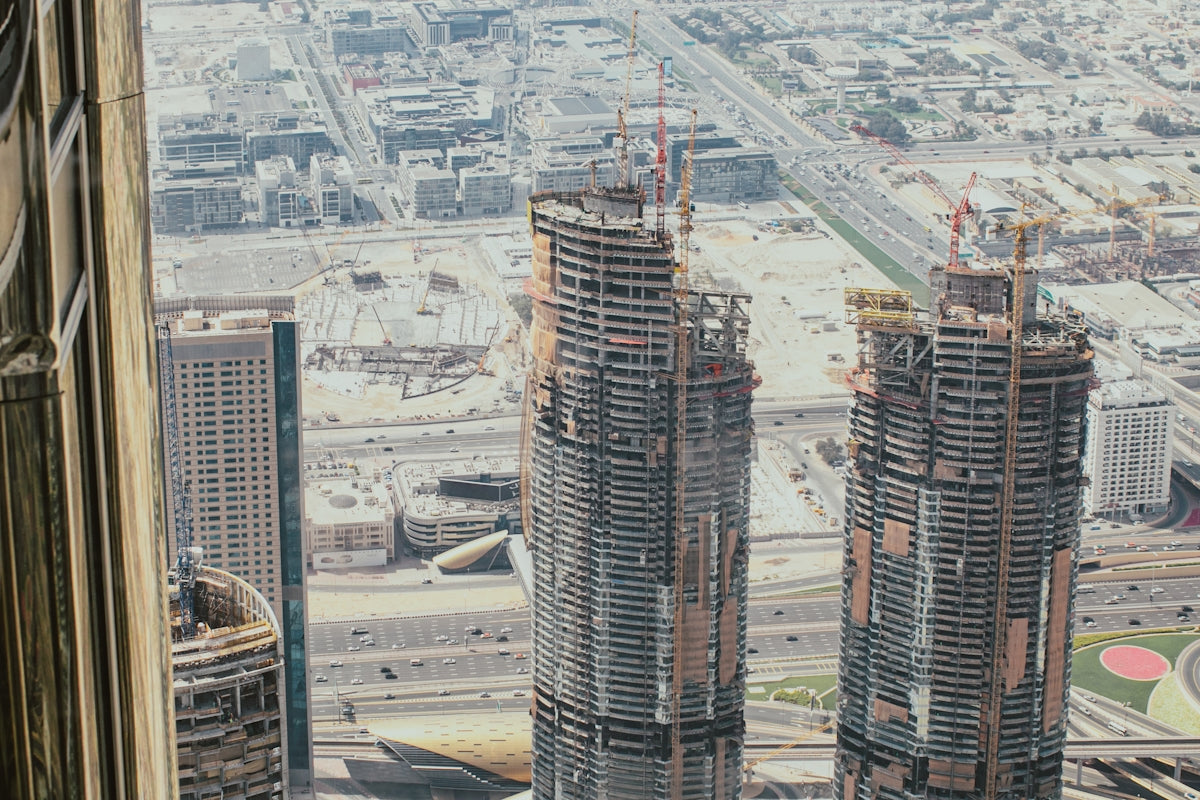 a couple of tall buildings sitting next to each other