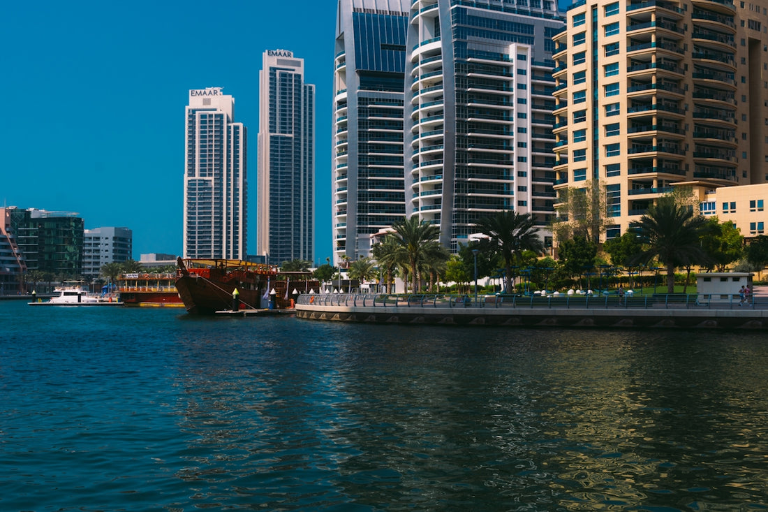 a body of water with buildings in the background