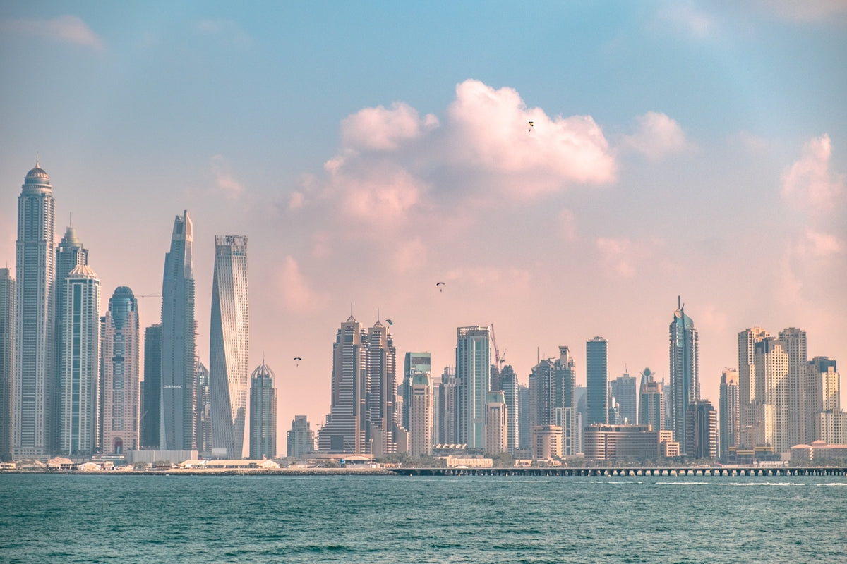 a large body of water with a city in the background