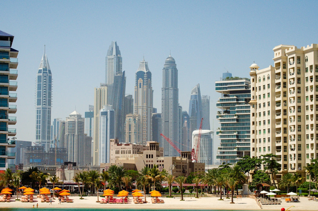 a view of a beach with a city in the background