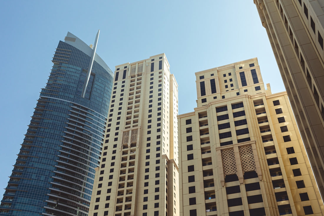 A group of tall buildings sitting next to each other