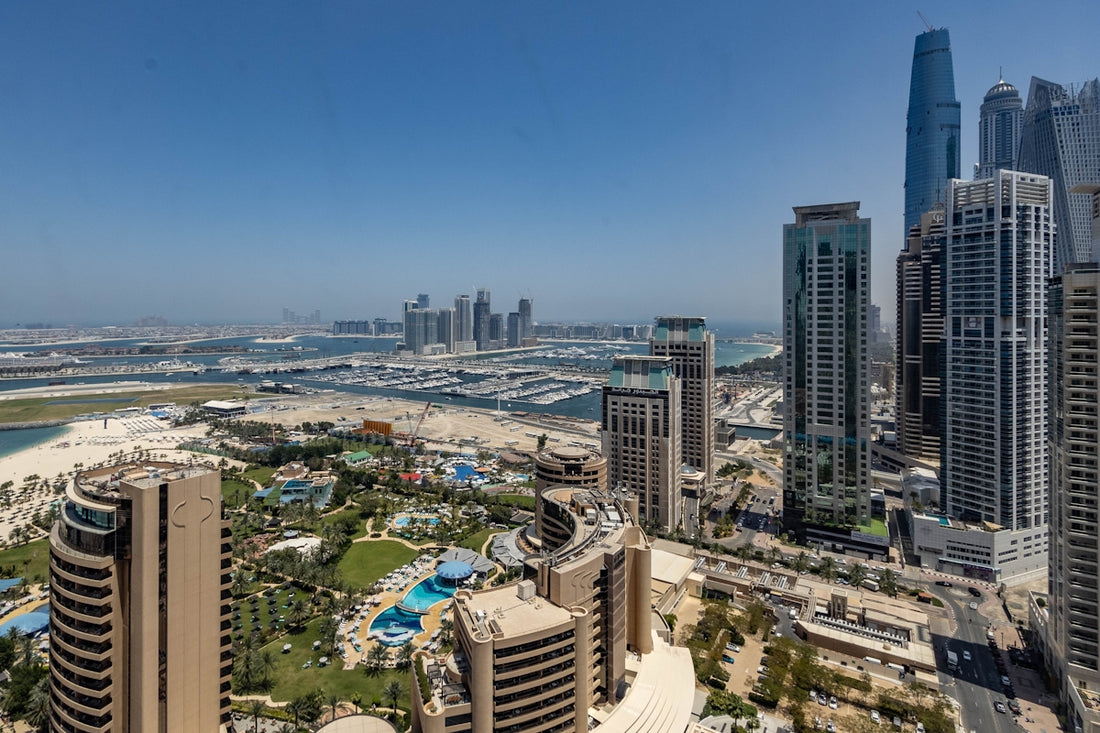 An aerial view of a city with tall buildings