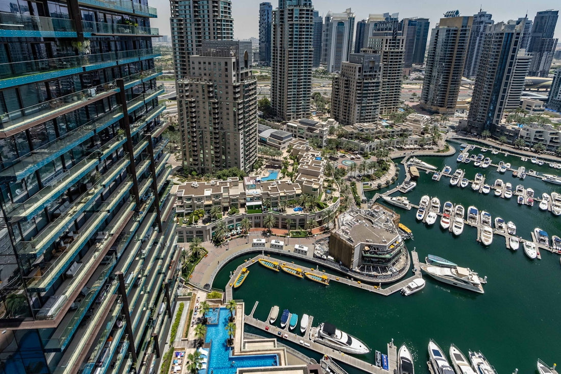 An aerial view of a city with boats in the water