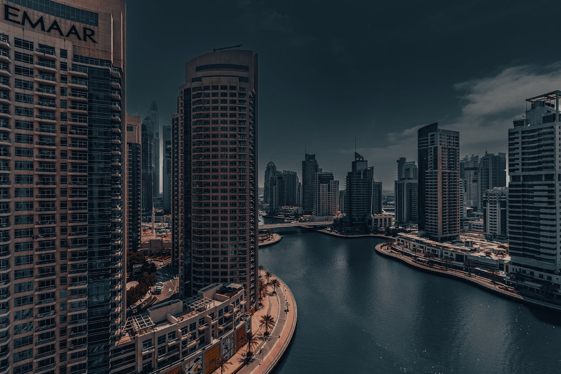 A river running through a city next to tall buildings