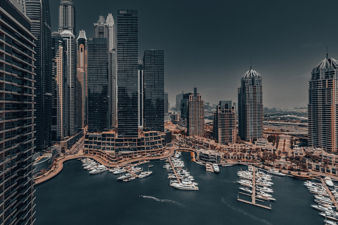 An aerial view of a city with boats in the water