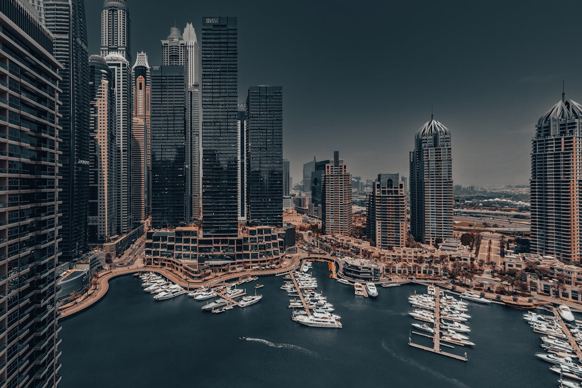 An aerial view of a city with boats in the water