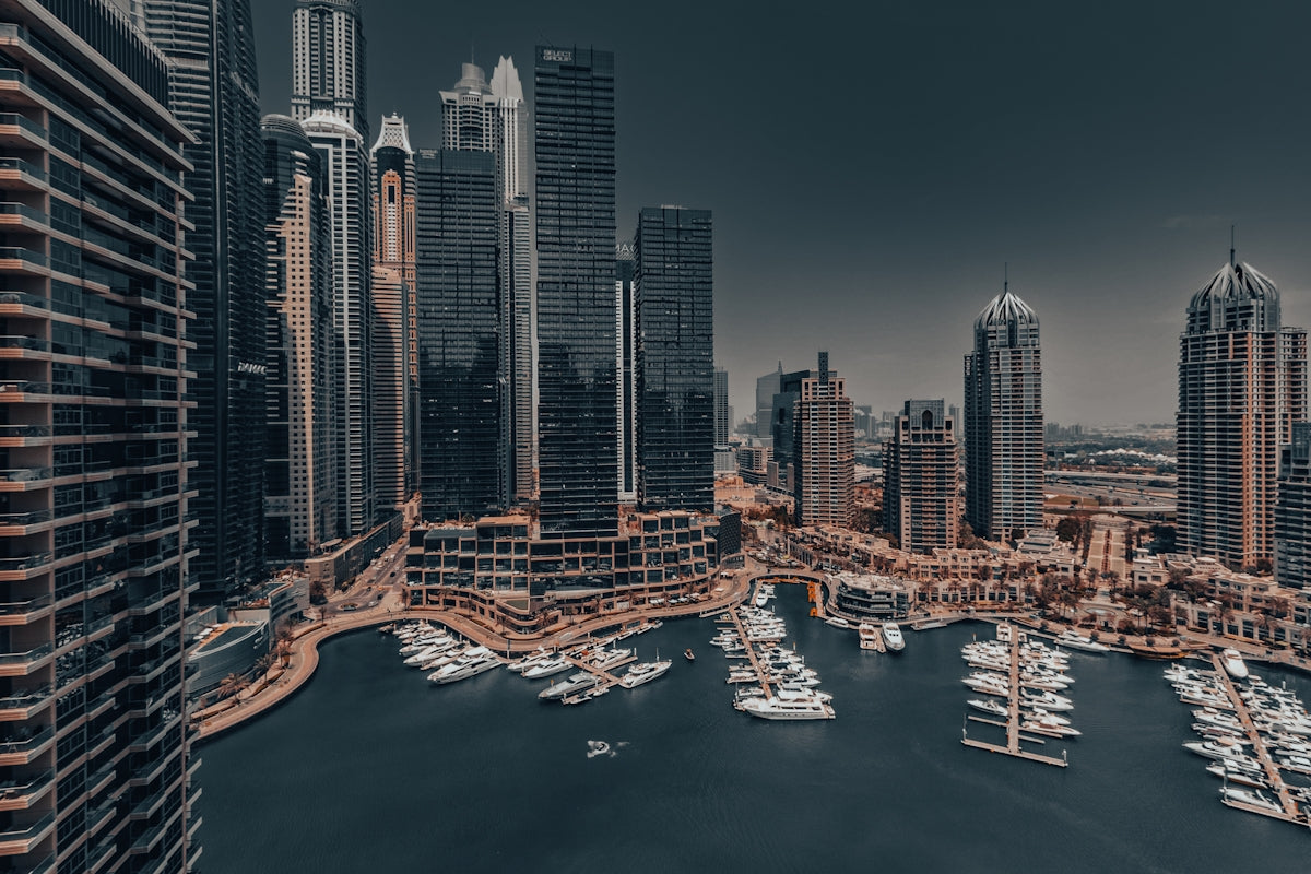An aerial view of a city with boats in the water