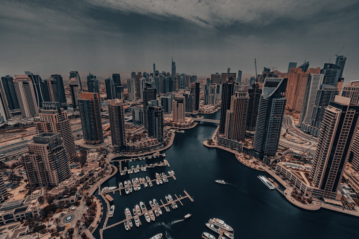 An aerial view of a city with boats in the water