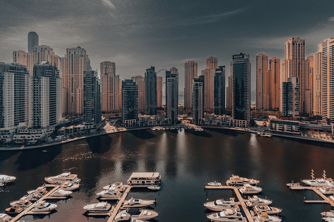 A harbor filled with lots of boats under a cloudy sky