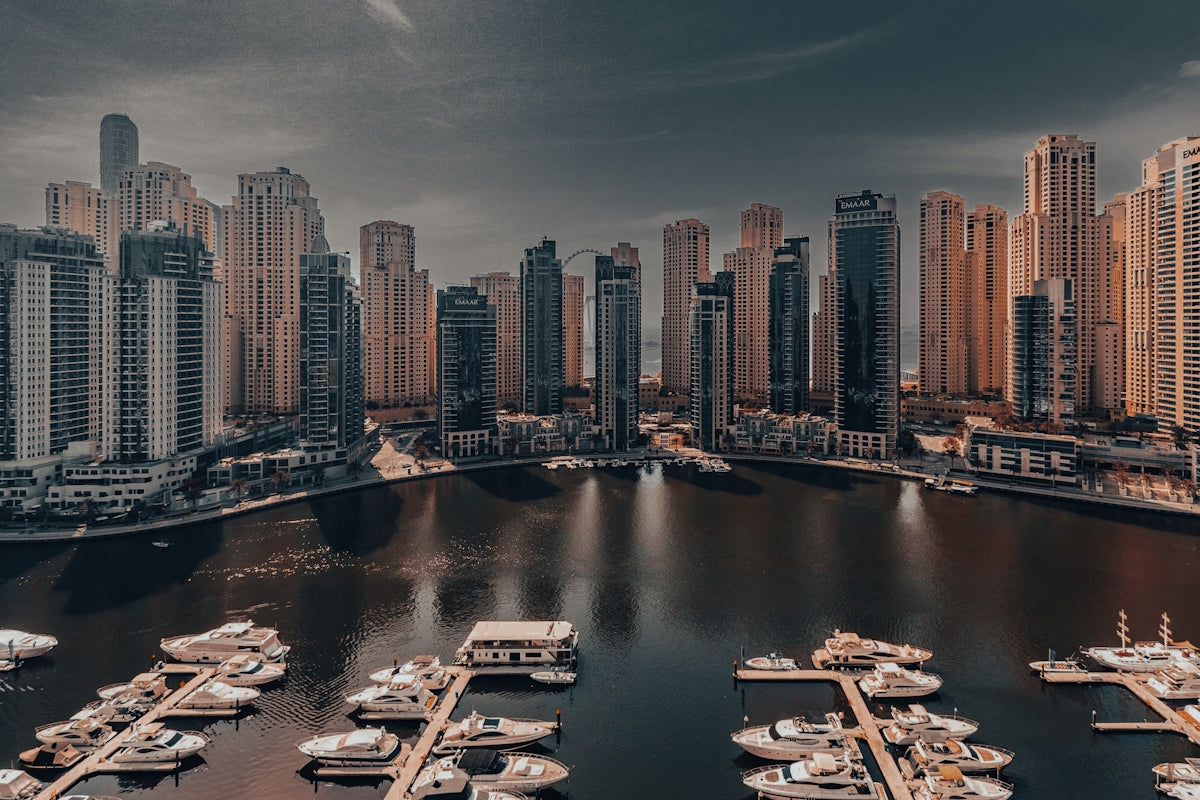 A harbor filled with lots of boats under a cloudy sky