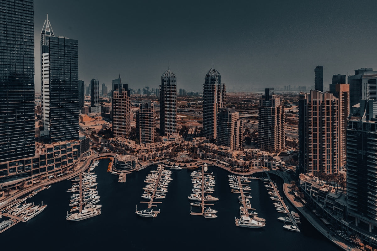 An aerial view of a city with boats in the water