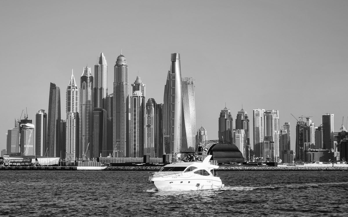A black and white photo of a boat in the water