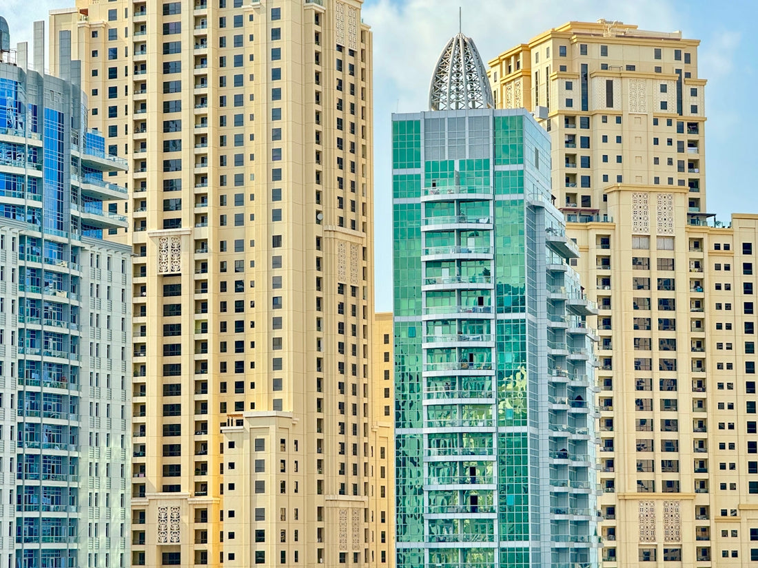 A group of tall buildings sitting next to each other