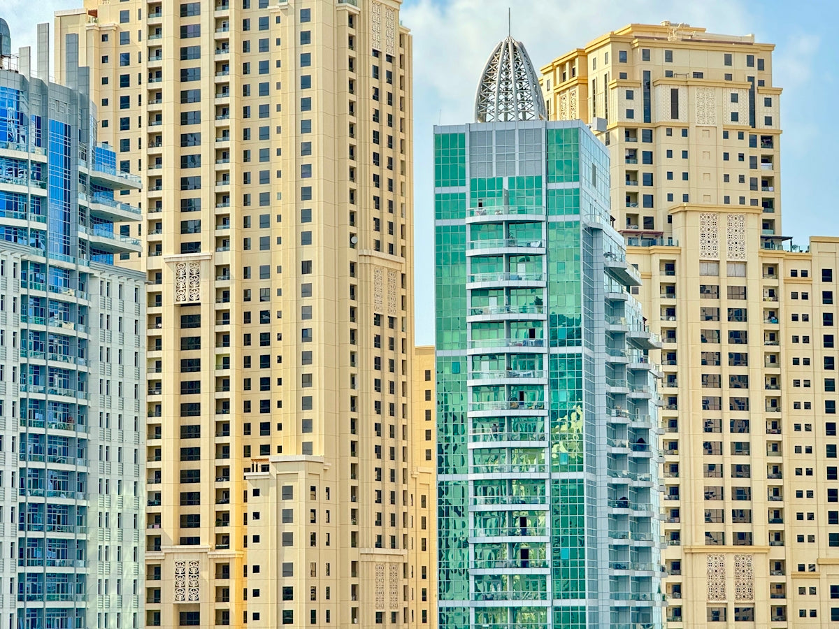 A group of tall buildings sitting next to each other