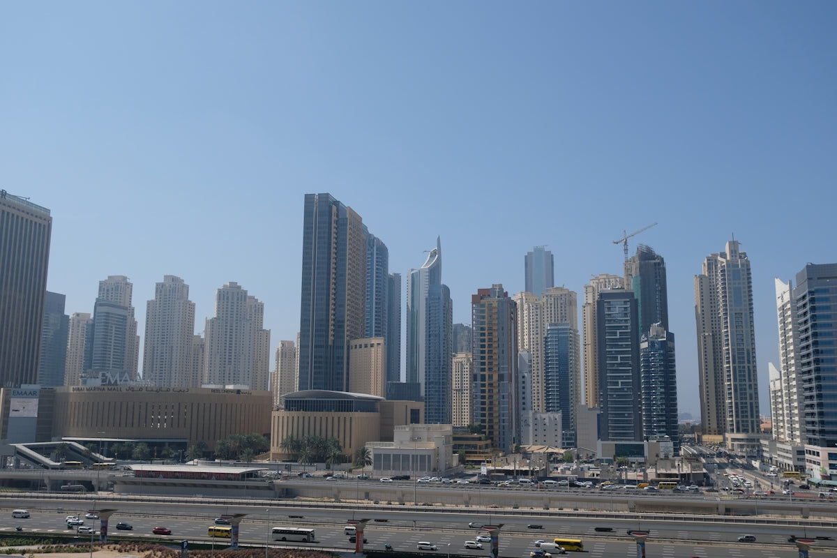 Dubai's skyline rises against a clear blue sky.