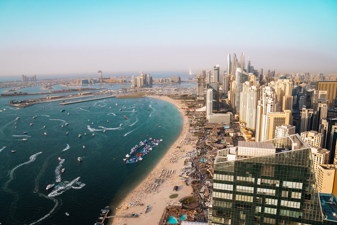 Dubai's coastline and cityscape from an aerial view.