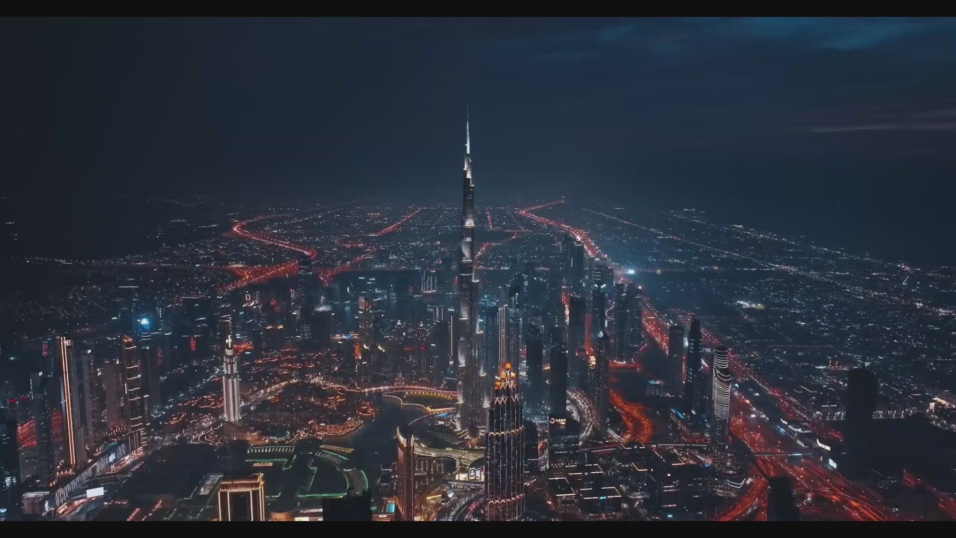Aerial video of Burj Khalifa in Dubai with other properties city skyline night view